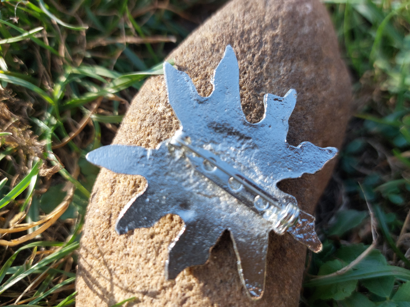 Eguzkilore broche latón